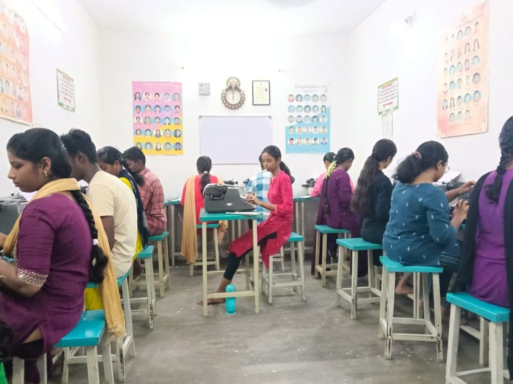Students practising on manual typewriters in the Niathi classroom